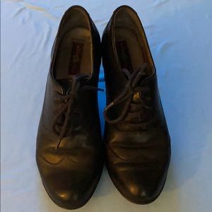 Borne Black Leather Wingtip Heels